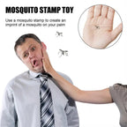 Man reacting humorously to a mosquito stamp imprint on his palm, showcasing the Mosquito Prank Stamp toy for pranks.